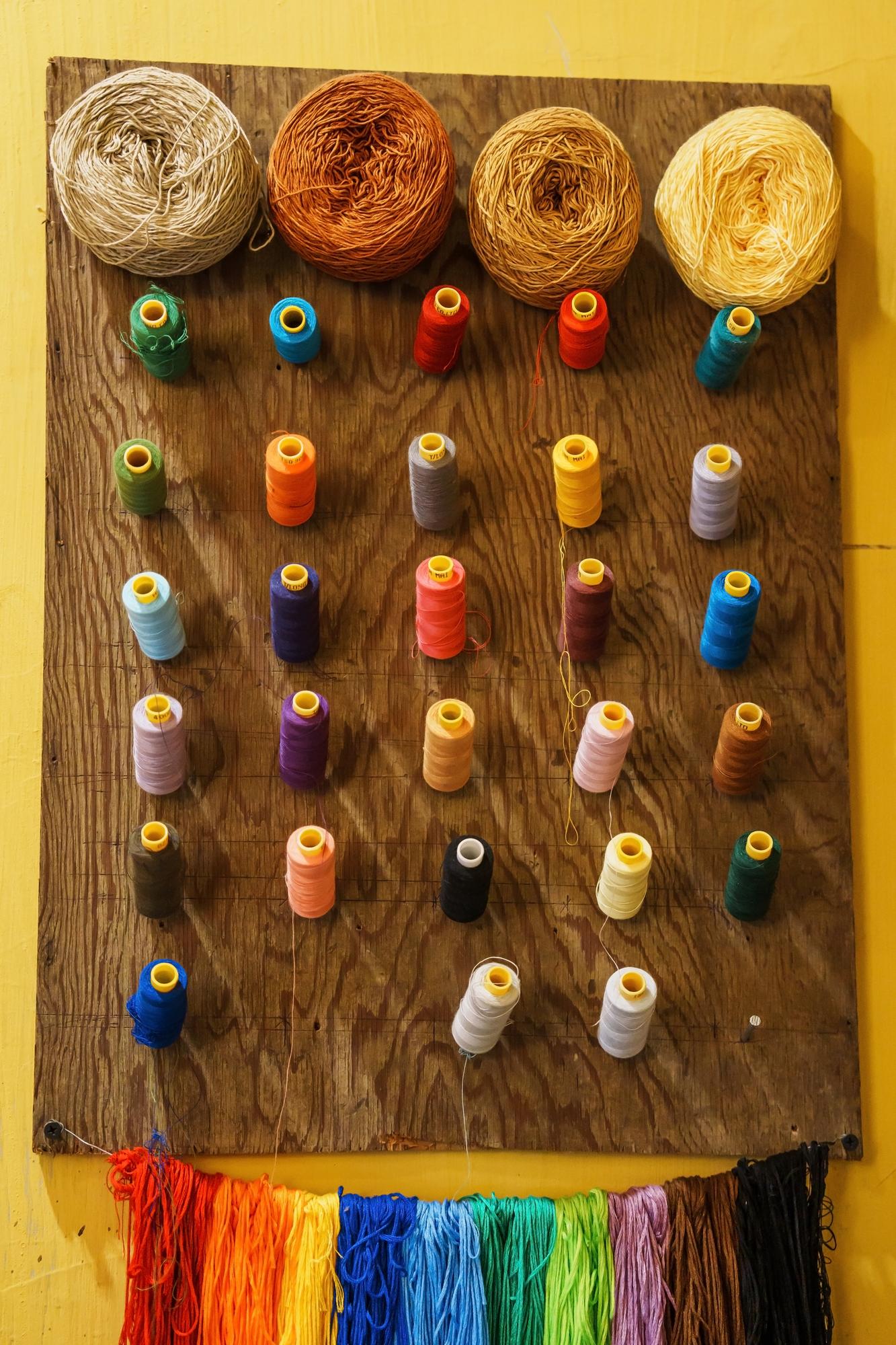 Assorted embroidery samples laid out on table